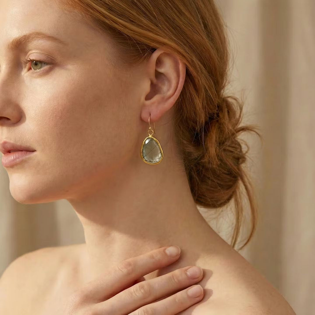 Model wearing Aquamarine Gold 22ct handcrafted earing.
