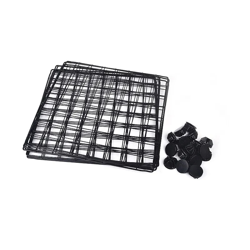 Black wire mesh tray with straps on a white background