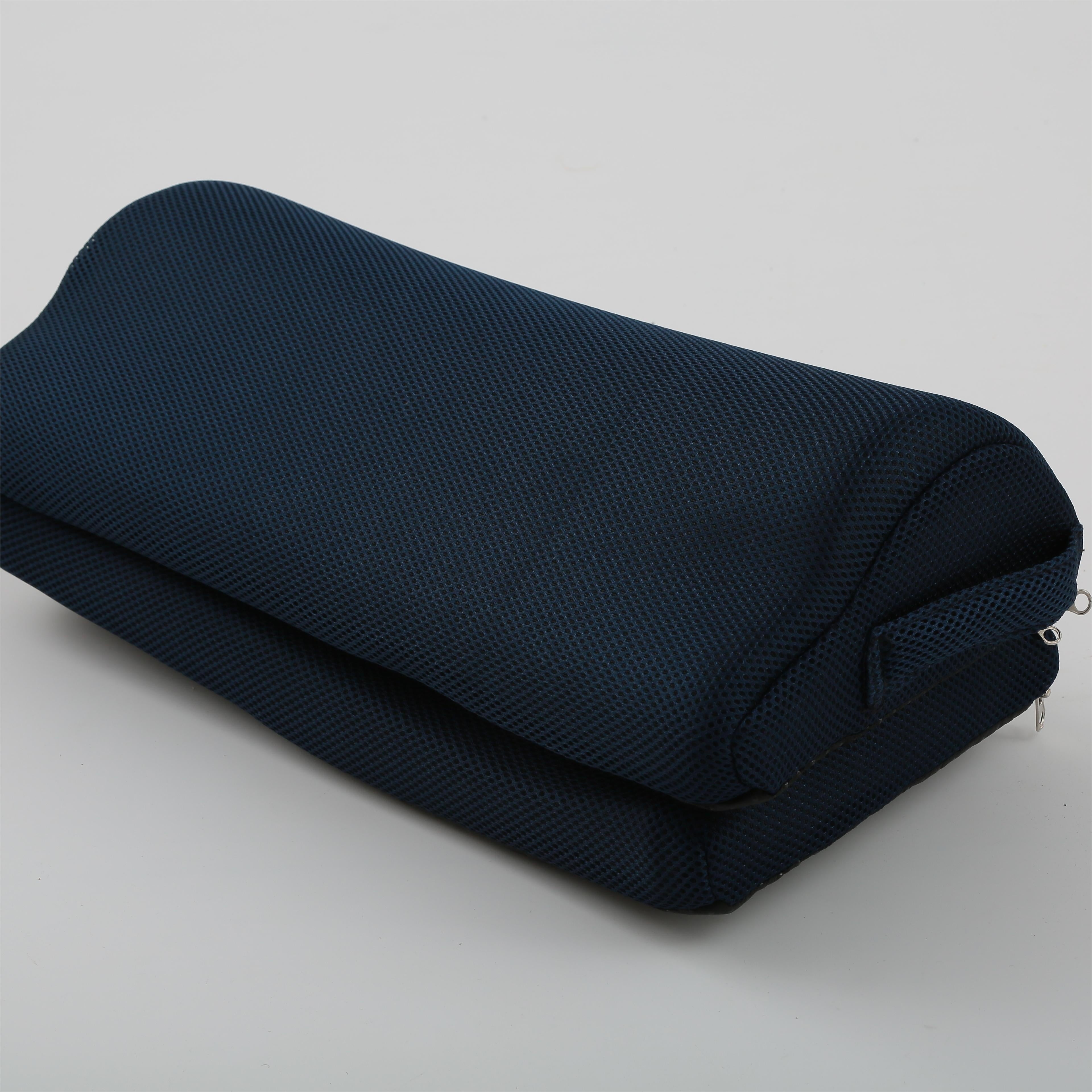Folded dark blue blanket on a light gray background