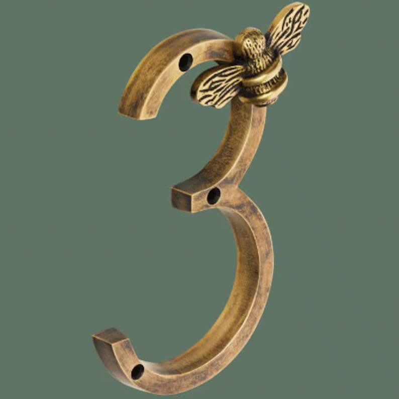 Bronze number '3' with a decorative design on a transparent background