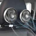 Two car air vent fans mounted on a car's interior dashboard.