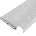 Metallic rectangular object with a textured surface on a white background