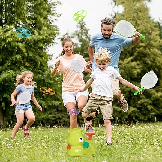Family playing with green toy in a park