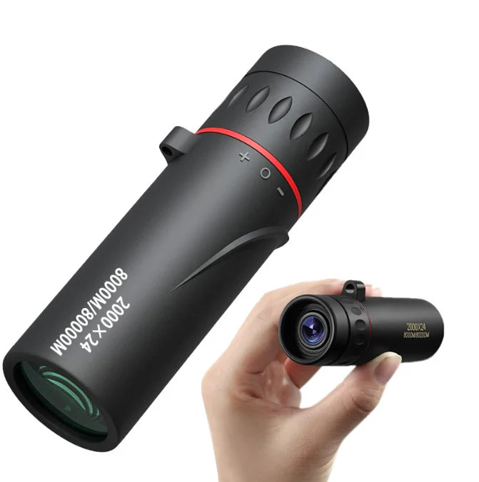 Black monocular telescope with hand holding it on a white background