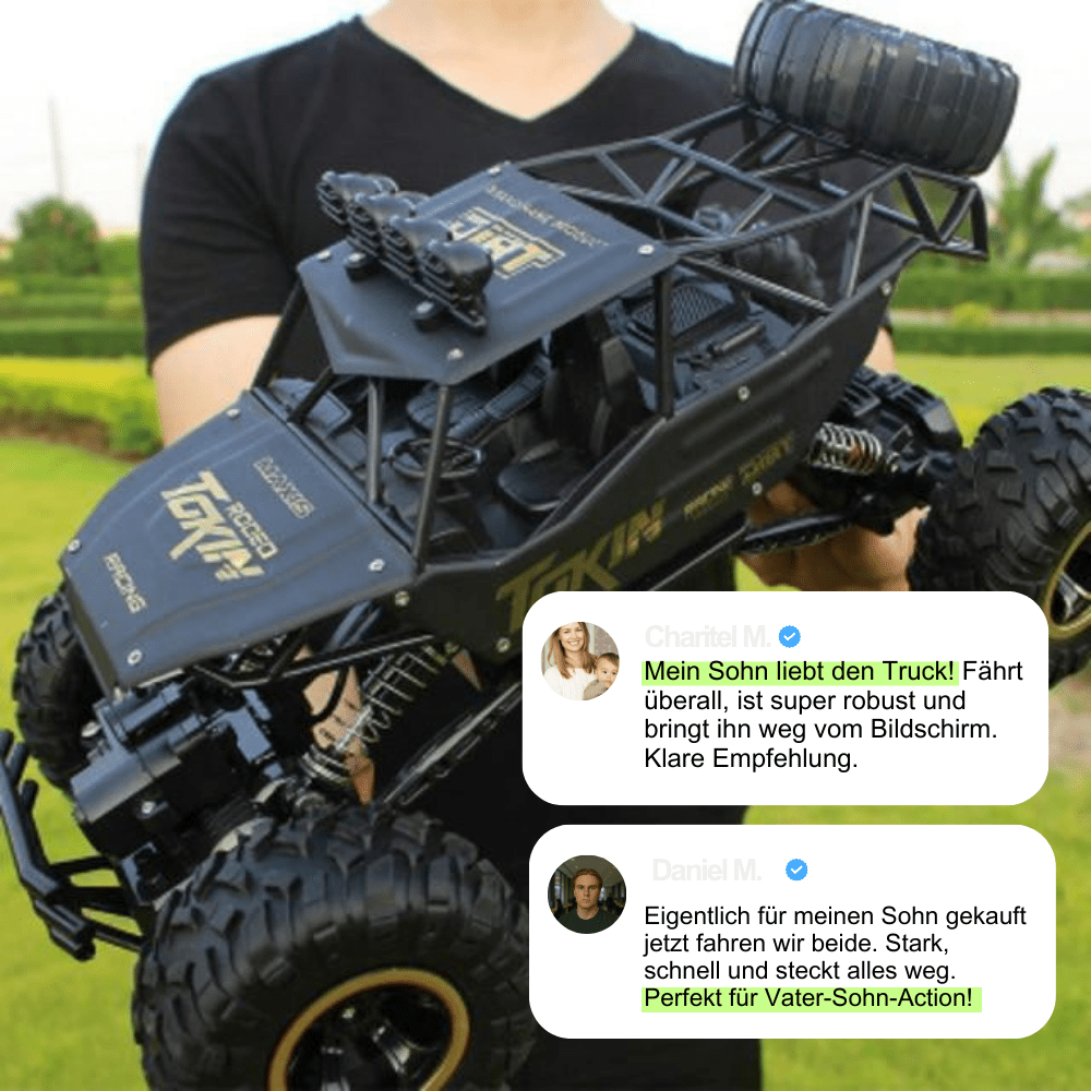 Person holding a large black remote control truck with text overlay on a grassy background