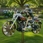 Skeleton figure on a motorcycle in a garden setting