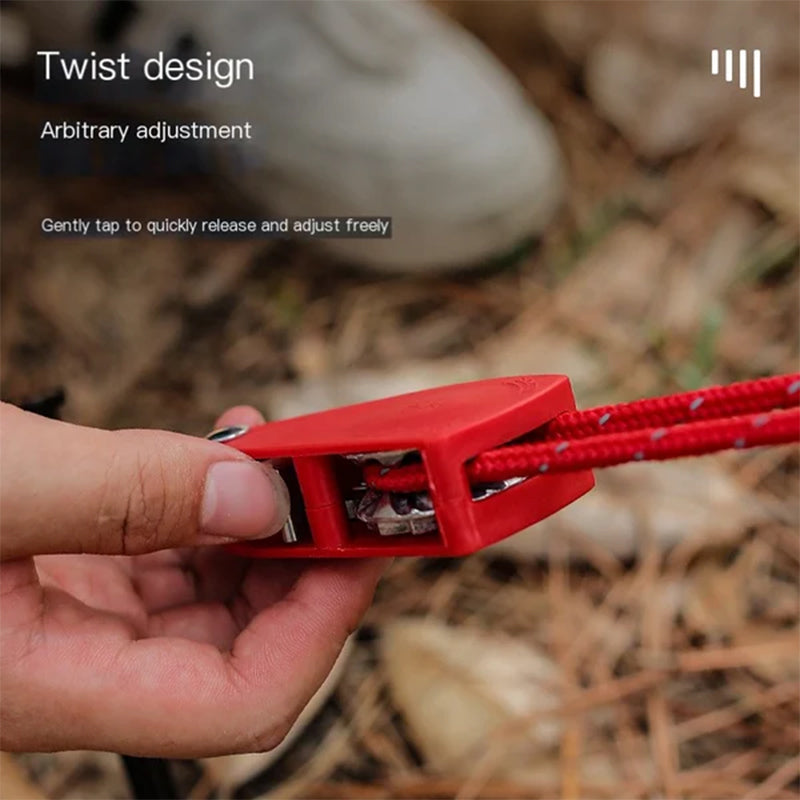 Red adjustable strap with twist design held by a hand, blurred natural background