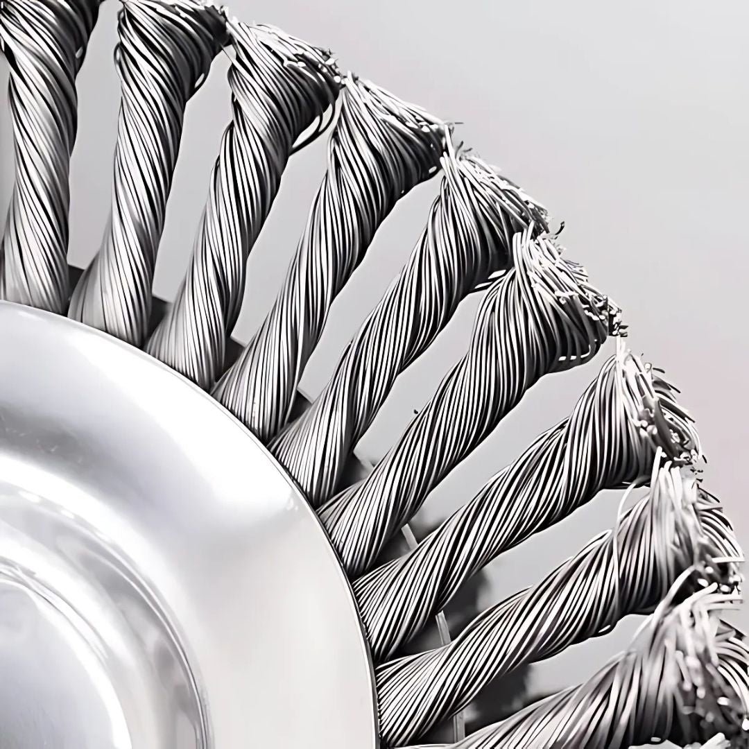 Close-up of braided metal cable on a gray background