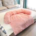 Pink fluffy blanket on a bed in a bedroom setting