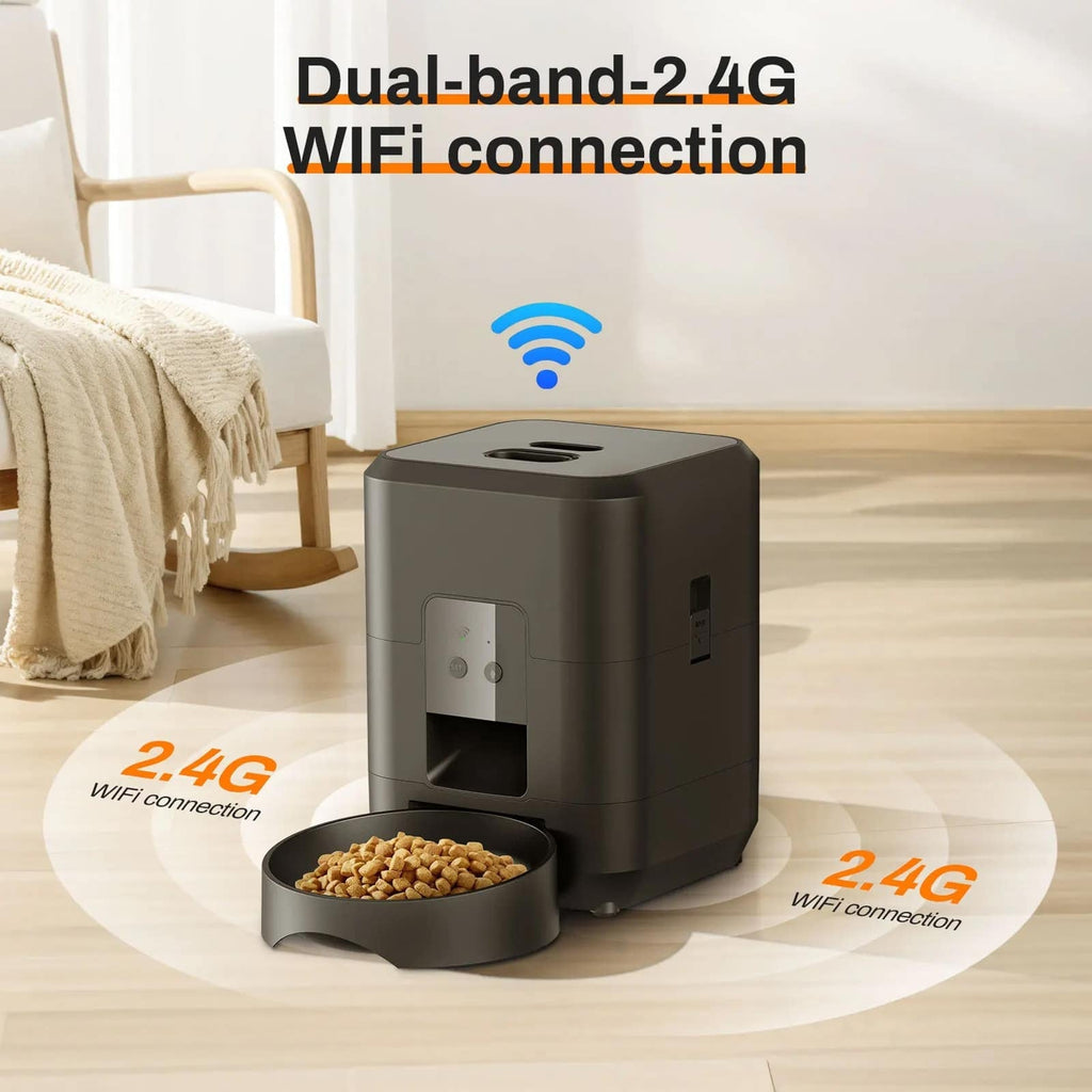 Black pet feeder with 2.4G WiFi connection on a light wood floor.