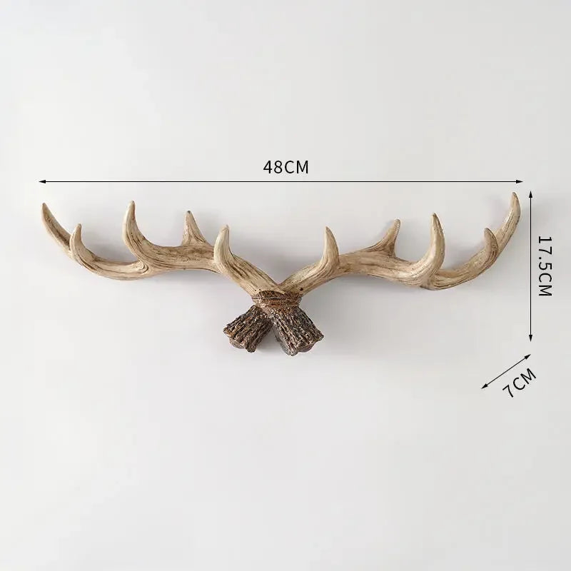 Decorative antler wall hook with measurements on a white background