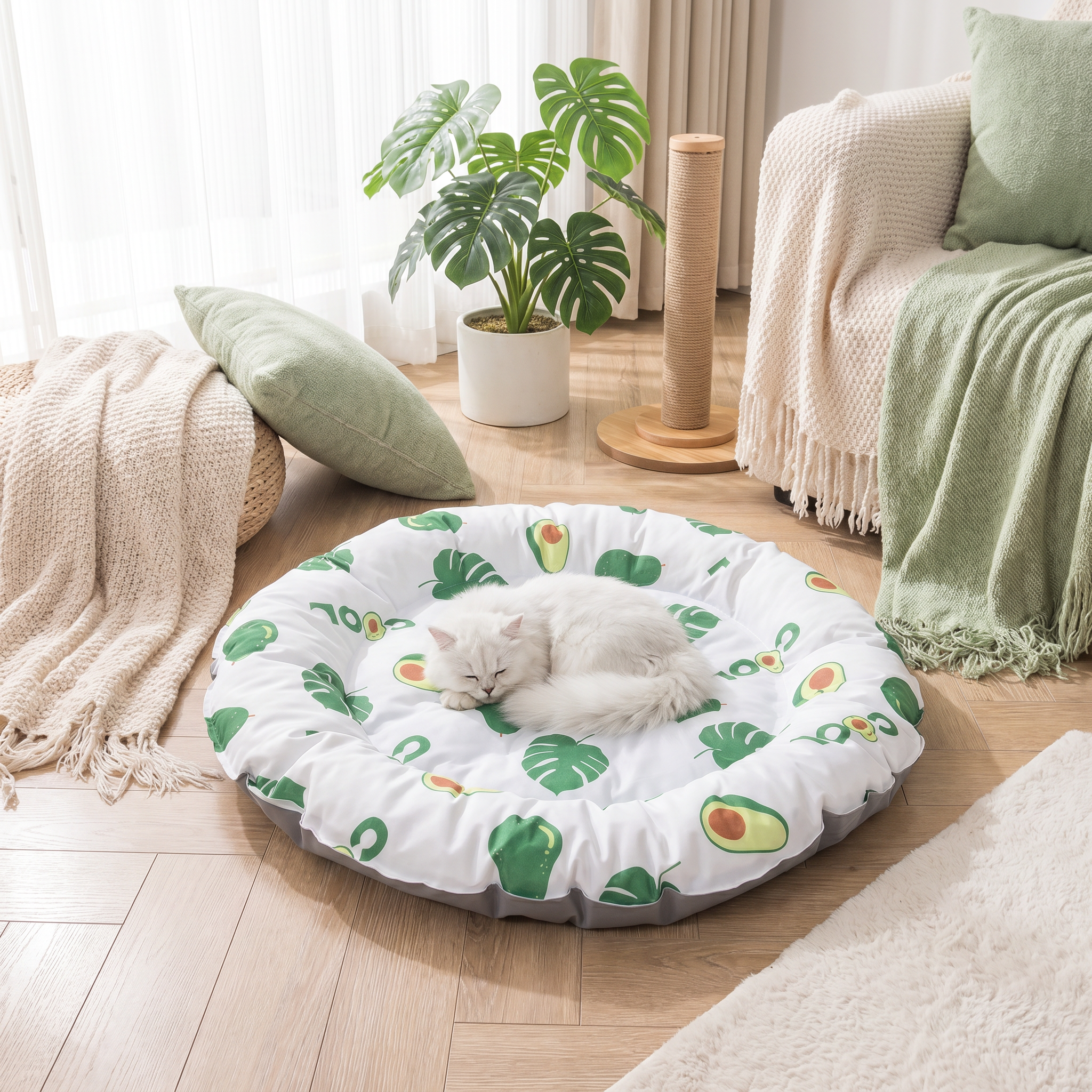 White cat sleeping on a round pet bed with green leaf pattern in a cozy living room.