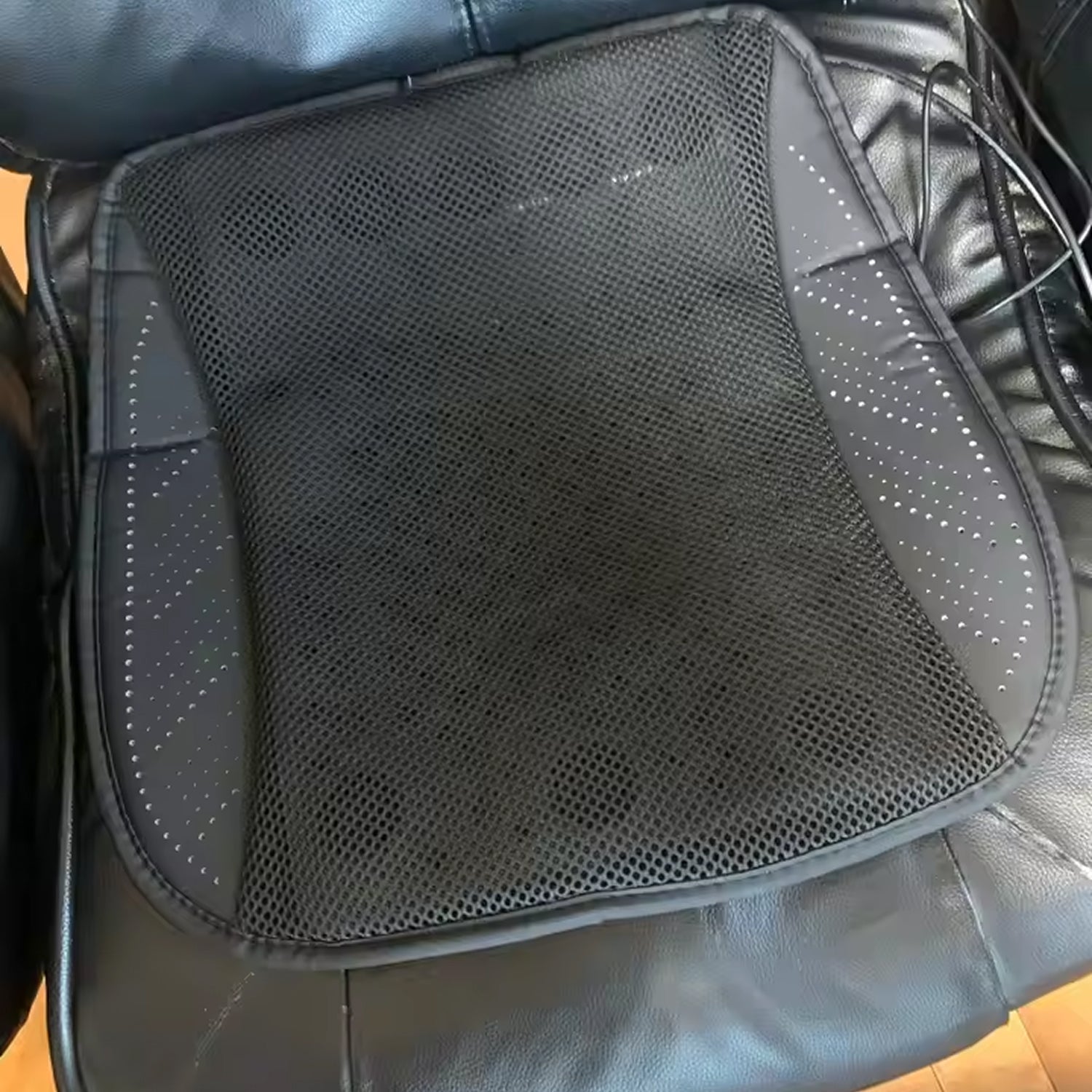 Black mesh seat cushion on a vehicle seat