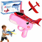 Toy airplane gun with pink handle and red airplane, accompanied by a child holding a similar toy, and packaging in the background.