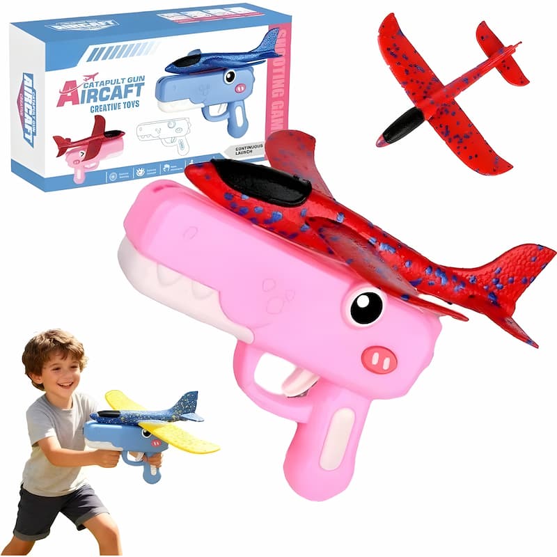 Toy airplane gun with pink handle and red airplane, accompanied by a child holding a similar toy, and packaging in the background.