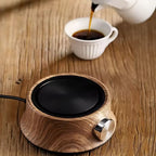 Wooden hot plate with a cup of coffee on a wooden surface