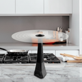 Black kitchen exhaust hood in a modern kitchen setting