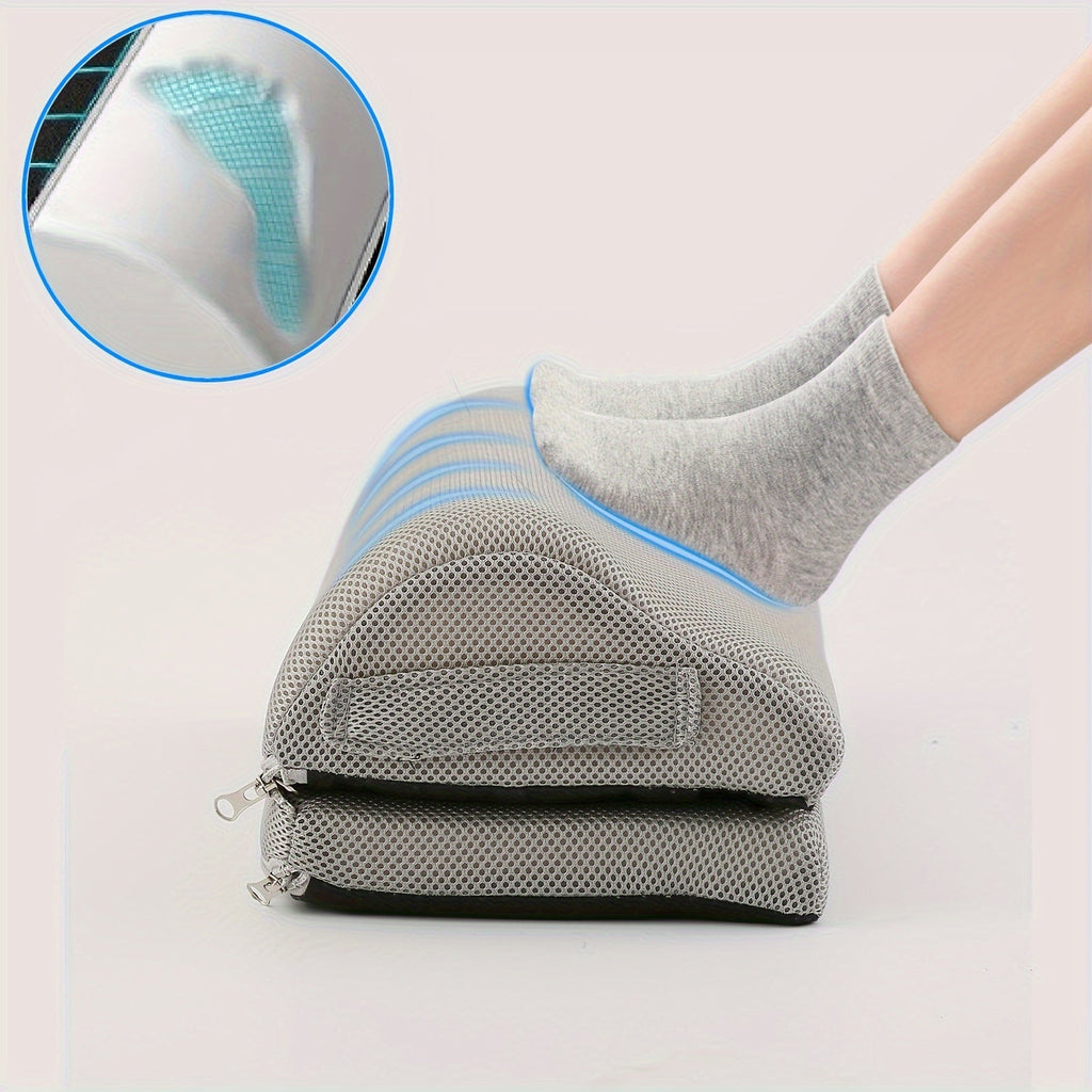 Gray socks with blue accents worn by a person, with a close-up of the sole showing a textured pattern.