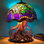 Stained glass jellyfish lamp with colorful design on a dark background