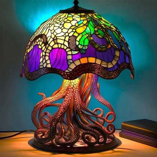 Stained glass jellyfish lamp with colorful design on a dark background