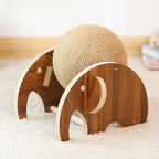 Wooden elephant toy with a sisal ball on a soft surface