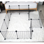 Black wire pet pen on a white carpeted floor