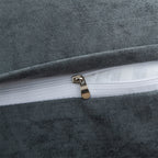 Close-up of a zipper on a gray textured fabric