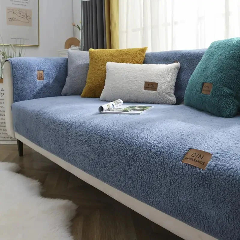 Blue sofa with decorative pillows in a living room setting