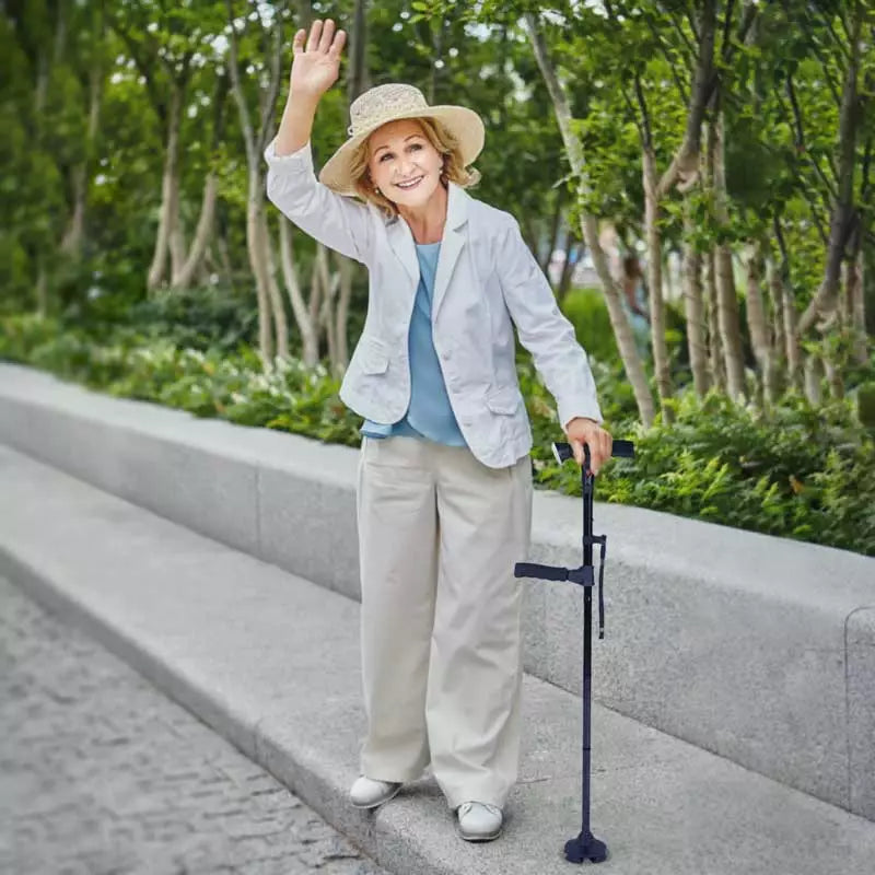 Woman with a walking stick waving in a park setting
