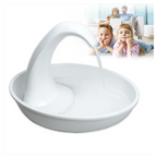 White plastic toy boat with a family in the background