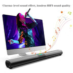 Soundbar in front of a computer screen with a person singing, emphasizing high-quality sound.