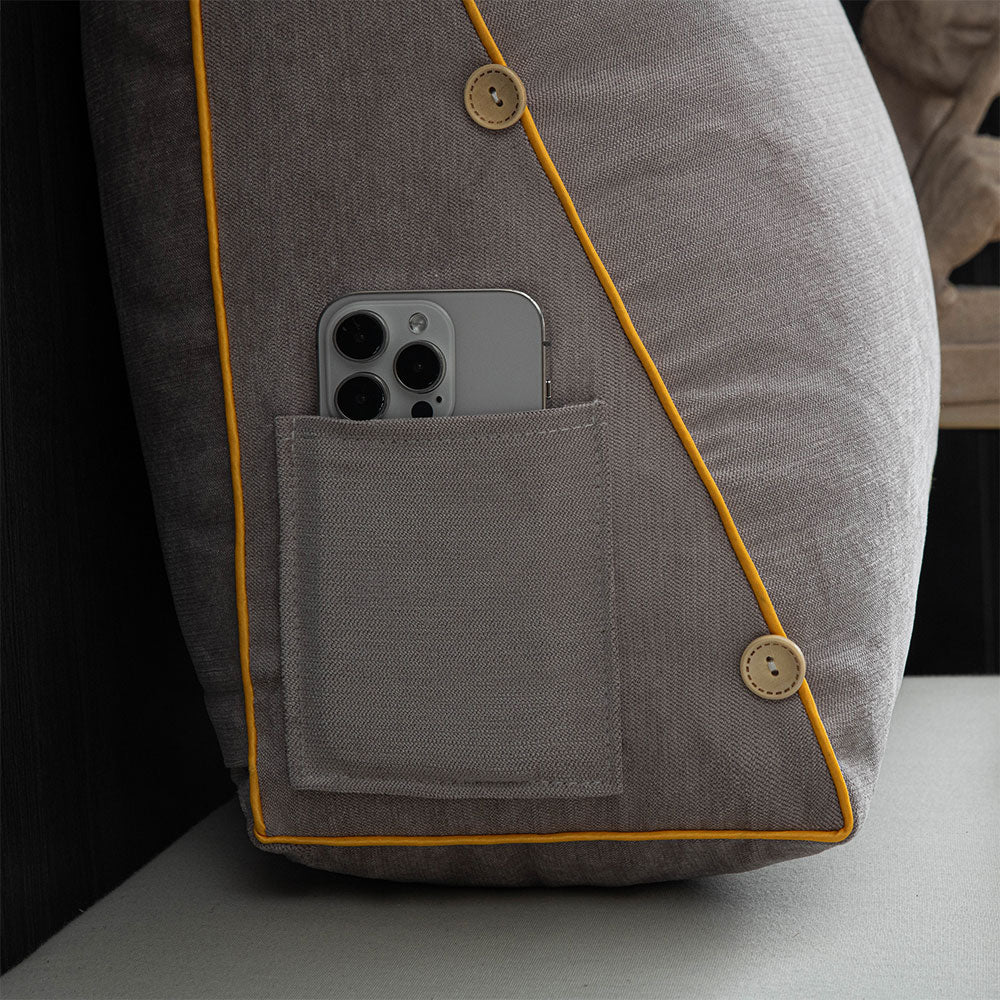 Gray jacket with a pocket containing a smartphone, on a neutral background