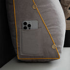 Gray jacket with a pocket containing a smartphone, on a neutral background