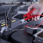 Smart clamp and return alarm system being used on a car battery with text about blind spot detection technology.