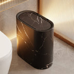 Black marble-patterned trash can in a bathroom setting