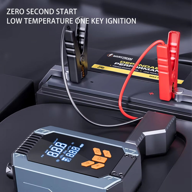 Car battery jump starter with digital display and clamps on a dark background