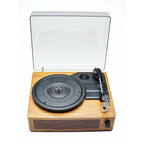 Wooden record player with a clear dust cover on a white background