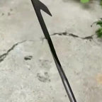 Metal arrow on a concrete surface