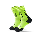 Pair of bright green socks with black accents on a white background