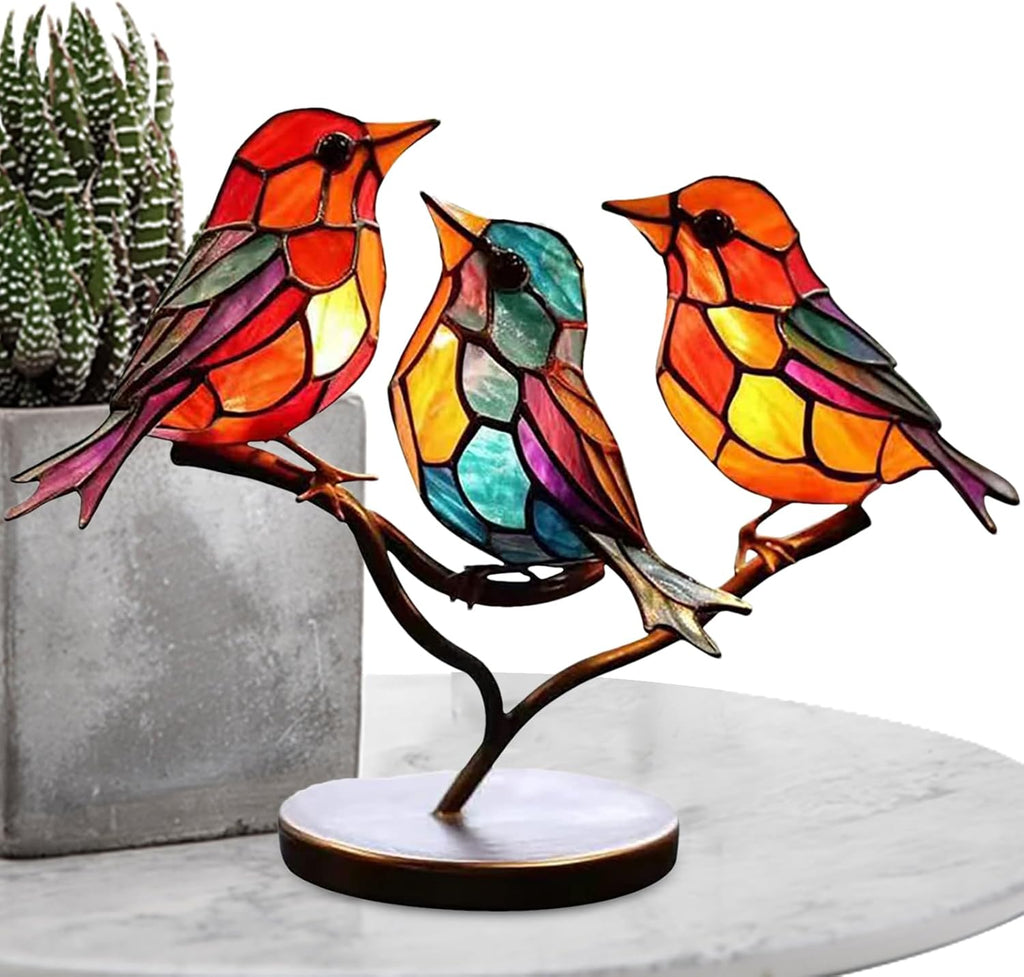Colorful stained glass bird lamp on a branch with a white background