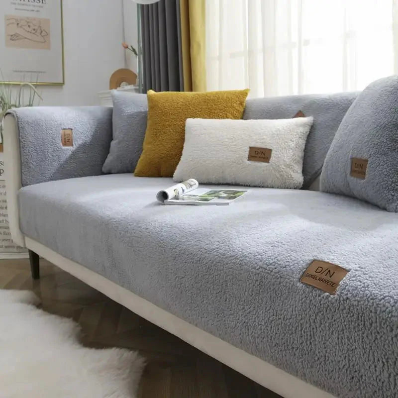 Gray sofa with decorative pillows in a living room setting