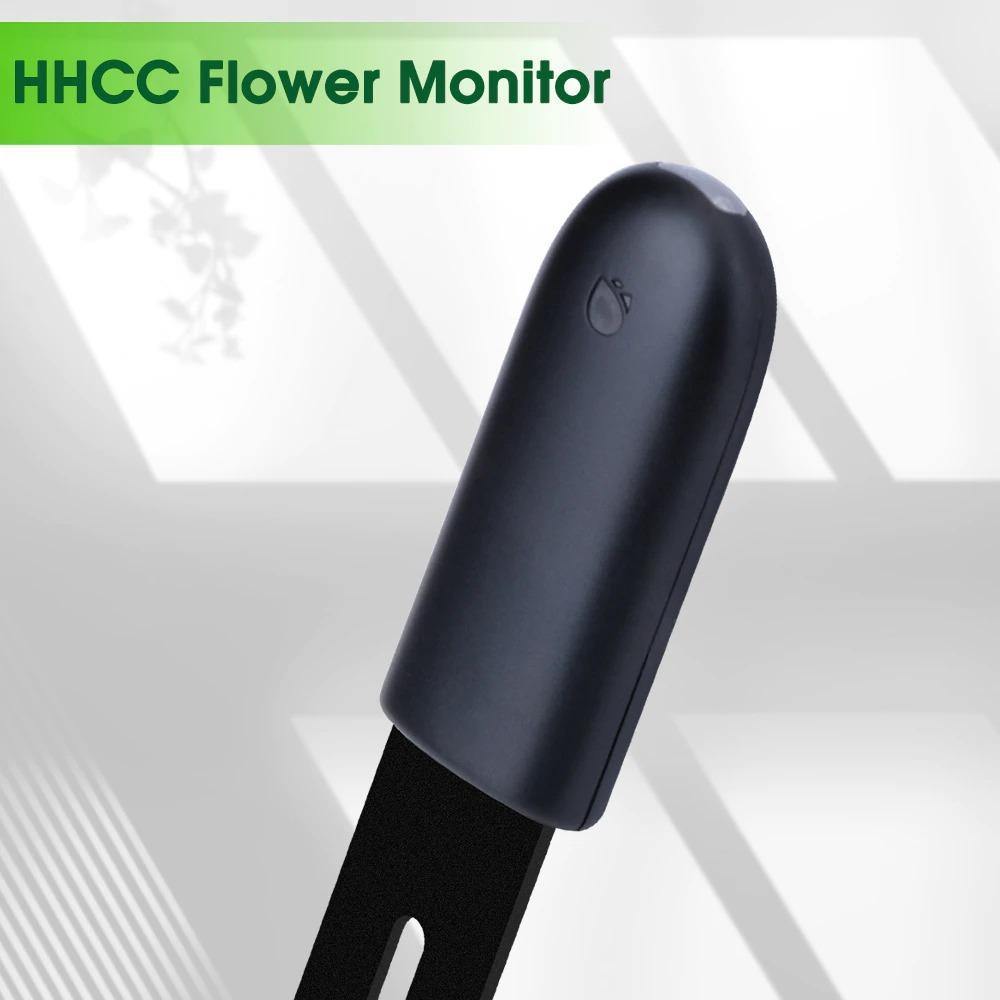 Black flower monitor with 'HHCC Flower Monitor' text on a light gray background