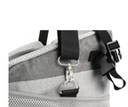 Gray duffel bag with black straps and a metal clasp on a white background