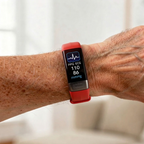 Person wearing a smartwatch with health monitoring app on a blurred background