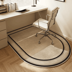Beige office chair on a large round rug in front of a desk.
