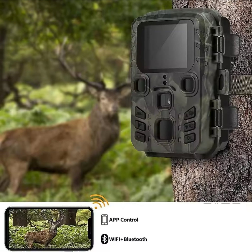 Camouflage trail camera attached to a tree with a deer in the background, showing app control and connectivity features.