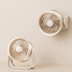 Two beige fans on a beige background