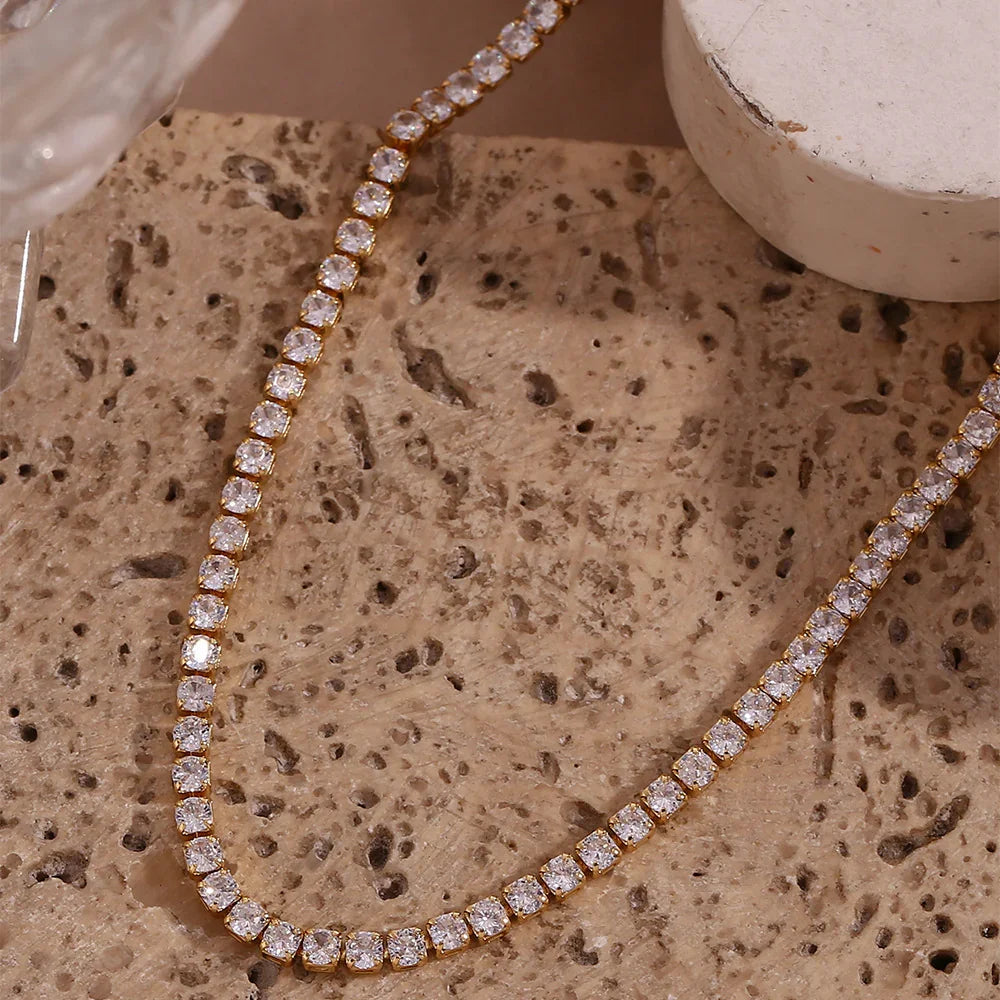 Diamond necklace on a textured stone surface