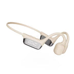 Beige wireless earbuds with a charging case on a white background