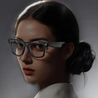 Person wearing glasses with a dark background